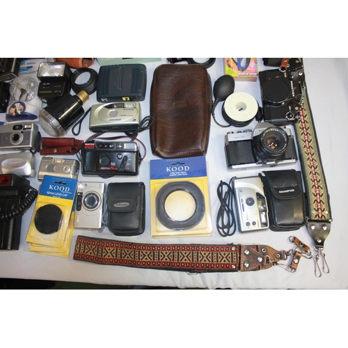 36 - BOX OF CAMERAS AND EQUIPMENT - DIGITAL CAMERAS, DIGITAL CAMERA TRIPOD, LENS CAPS, ETC