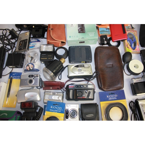 36 - BOX OF CAMERAS AND EQUIPMENT - DIGITAL CAMERAS, DIGITAL CAMERA TRIPOD, LENS CAPS, ETC