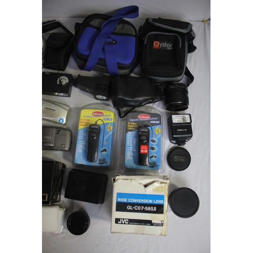 140 - BOX OF CAMERAS AND EQUIPMENT - DIGITAL CAMERAS, LENSES, FLASH UNIT AND CASES