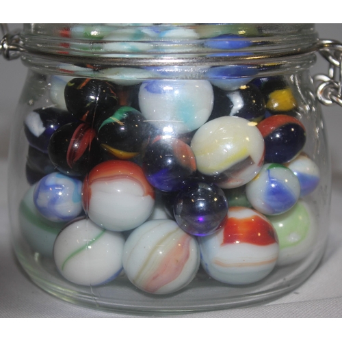 154 - 3 GLASS JARS, TUB AND BAG OF MARBLES