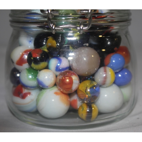 154 - 3 GLASS JARS, TUB AND BAG OF MARBLES