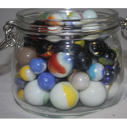 154 - 3 GLASS JARS, TUB AND BAG OF MARBLES