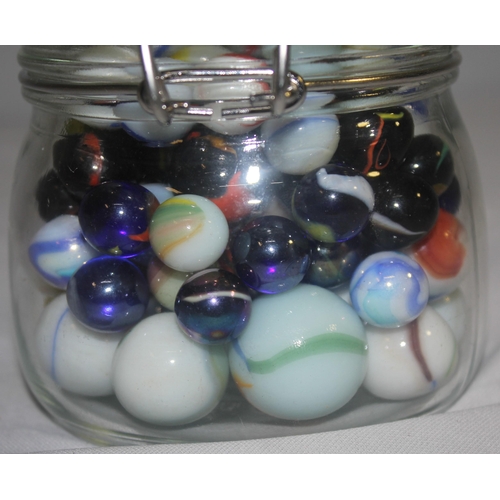 154 - 3 GLASS JARS, TUB AND BAG OF MARBLES