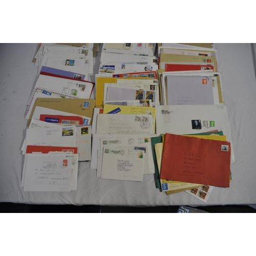 257 - BOX OF POSTAL ENVELOPES WITH STAMPS AND BOX OF POSTCARDS WITH STAMPS