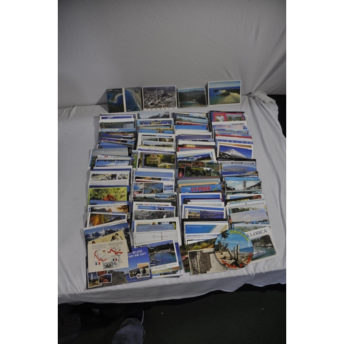 257 - BOX OF POSTAL ENVELOPES WITH STAMPS AND BOX OF POSTCARDS WITH STAMPS