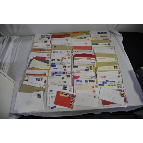 257 - BOX OF POSTAL ENVELOPES WITH STAMPS AND BOX OF POSTCARDS WITH STAMPS