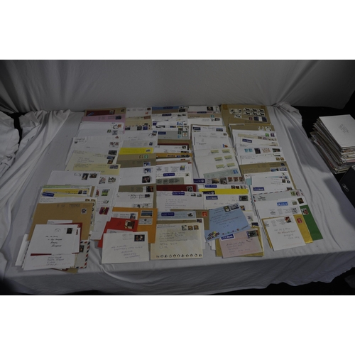 257 - BOX OF POSTAL ENVELOPES WITH STAMPS AND BOX OF POSTCARDS WITH STAMPS