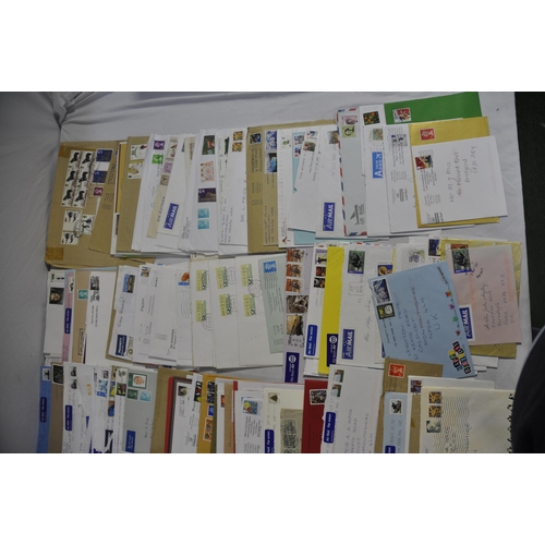 257 - BOX OF POSTAL ENVELOPES WITH STAMPS AND BOX OF POSTCARDS WITH STAMPS