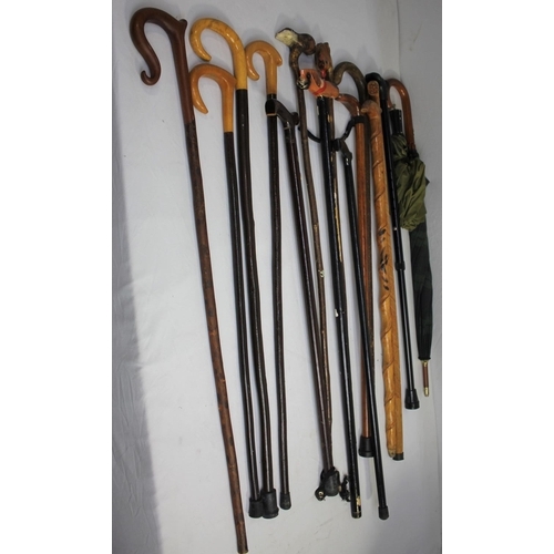 42 - BRASS UMBRELLA STAND AND BUNDLE OF WALKING STICKS