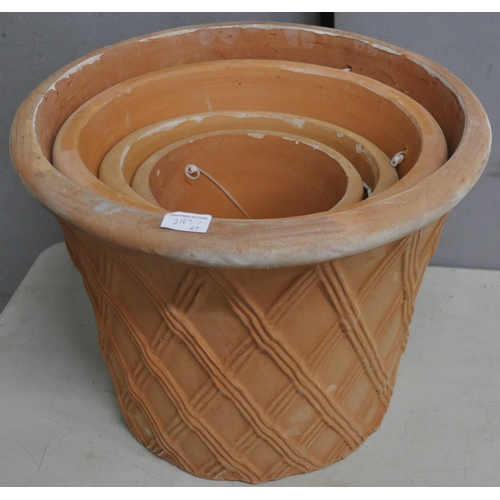 279 - SET OF 4 TERRACOTTA GRADUATED BASKET WEAVE PLANTERS