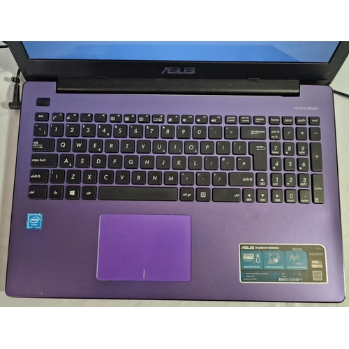 287 - PURPLE ASUS NOTEBOOK WITH CHARGER IN DELL CARRY BOX (MODEL X5536) WITH WINDOWS 10 - FAULTY BATTERY W... 