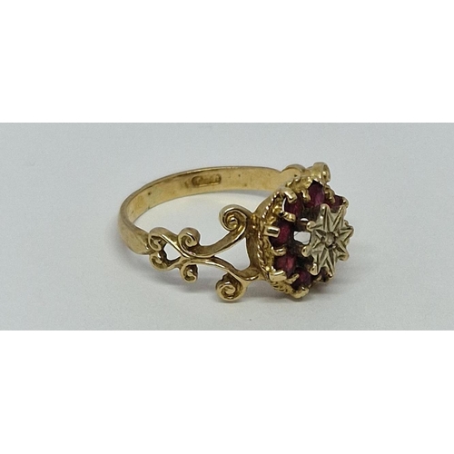 386 - 9ct GOLD RING SET WITH 1 DIAMOND AND 8 RED STONES - MARKINGS UNCLEAR 2.5g SIZE M