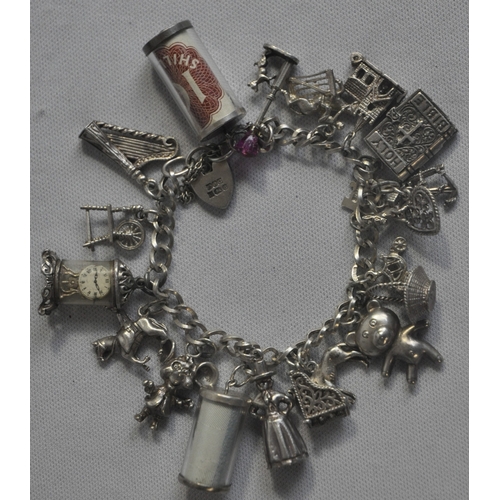 241 - SILVER CHARM BRACELET WITH CHARMS - SOME SILVER (TOTAL WEIGHT 61.1g)