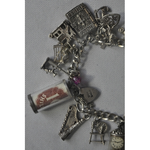 241 - SILVER CHARM BRACELET WITH CHARMS - SOME SILVER (TOTAL WEIGHT 61.1g)