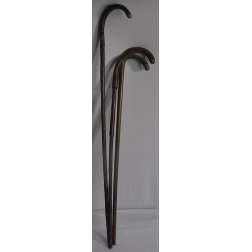 300 - GLASS UMBRELLA STAND WITH 3 WALKING STICKS