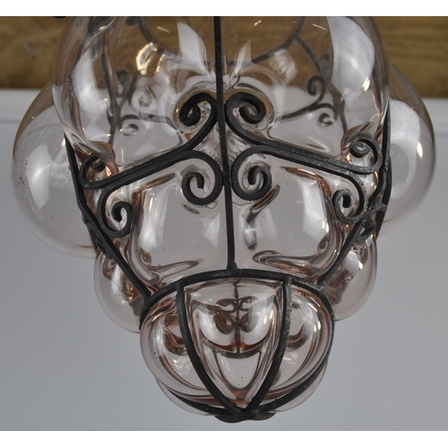 82 - 2 IRON AND COLOUR GLASS LIGHT FITTINGS c1930