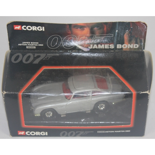 89 - 3 CORGI JAMES BOND DIE CAST VEHICLES, 4 PAPERBACK JAMES BOND BOOKS AND CORGI CADBURY'S MODEL