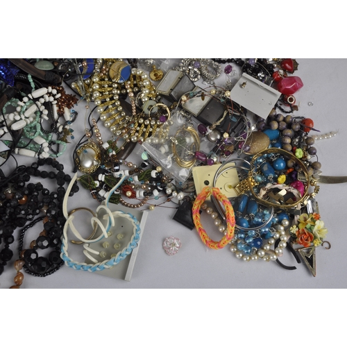 198 - 2 TUBS OF COSTUME JEWELLERY