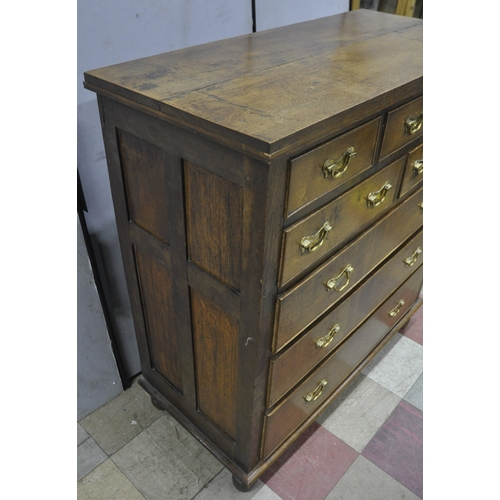 152 - OAK 8 DRAWER CHEST WITH GRADUATED DRAWERS AND BRASS DROP HANDLES