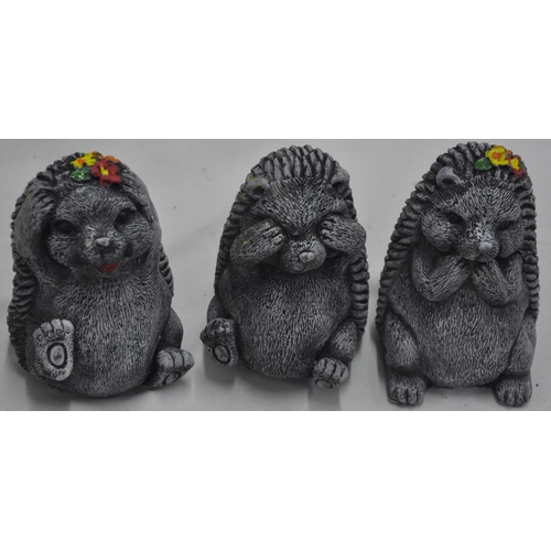 127 - 4 CONCRETE GARDEN ORNAMENTS - 3 HEDGEHOGS (SEE, HEAR, SPEAK NO EVIL) AND CHIMPANZEE