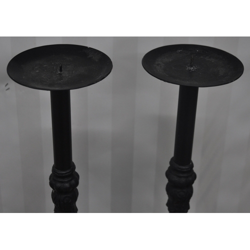 228 - PAIR CAST TALL CANDLESTICKS