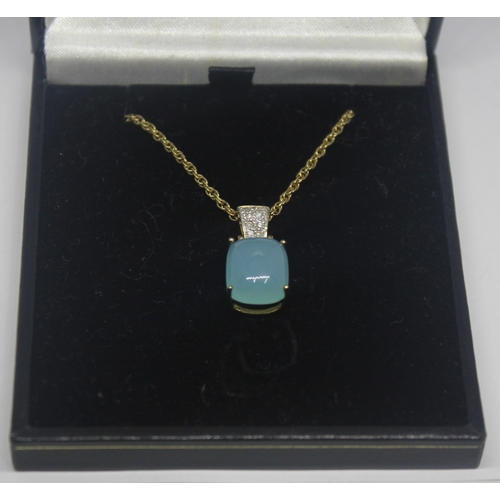 301 - GOLD PENDANT AND CHAIN MARKED 375 SET WITH DIAMONDS AND BLUE/GREEN STONE IN BLACK BOX 5.5g