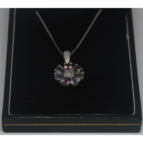 304 - WHITE GOLD PENDANT AND CHAIN MARKED 375 SET WITH MULTICOLOURED STONES AND DIAMONDS 3.2g