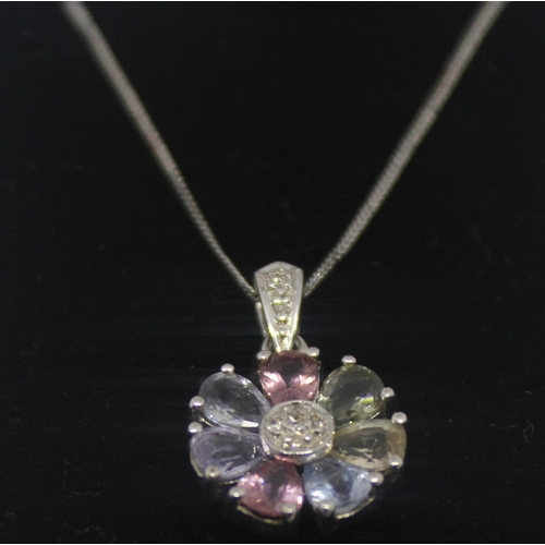 304 - WHITE GOLD PENDANT AND CHAIN MARKED 375 SET WITH MULTICOLOURED STONES AND DIAMONDS 3.2g