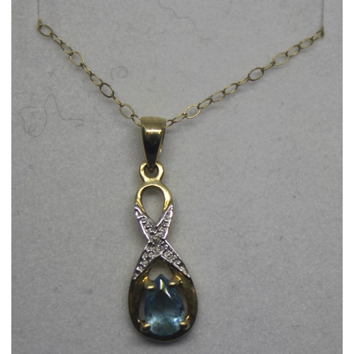 252 - 9CT GOLD CHAIN WITH YELLOW METAL DIAMOND AND BLUE TOPAZ PENDANT (1.15g)