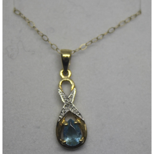 252 - 9CT GOLD CHAIN WITH YELLOW METAL DIAMOND AND BLUE TOPAZ PENDANT (1.15g)