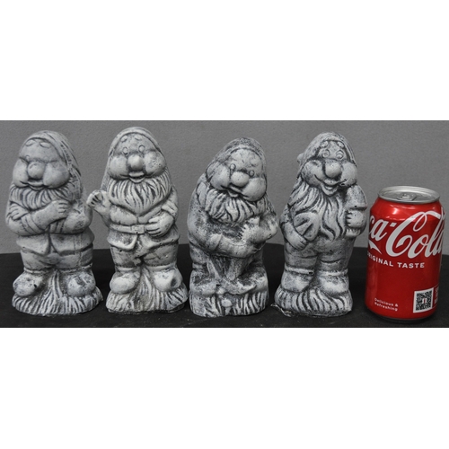 31 - 4 DWARF GARDEN ORNAMENTS