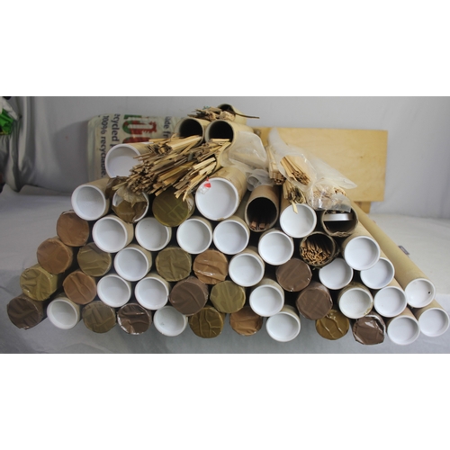 21 - QUANTITY OF TUBES CONTAINING VARIOUS MODEL BOAT BUILDING WOODEN STRIPS