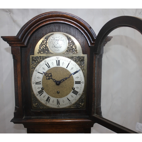 83 - TEMPUS FUGIT OAK CASED GRANDMOTHER CLOCK WITH KEY AND PENDULUM - WORM AFFECTED