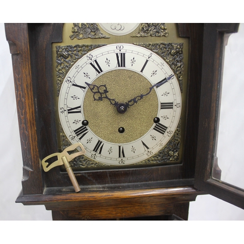 83 - TEMPUS FUGIT OAK CASED GRANDMOTHER CLOCK WITH KEY AND PENDULUM - WORM AFFECTED