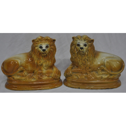 90 - PAIR OF STAFFORDSHIRE LIONS