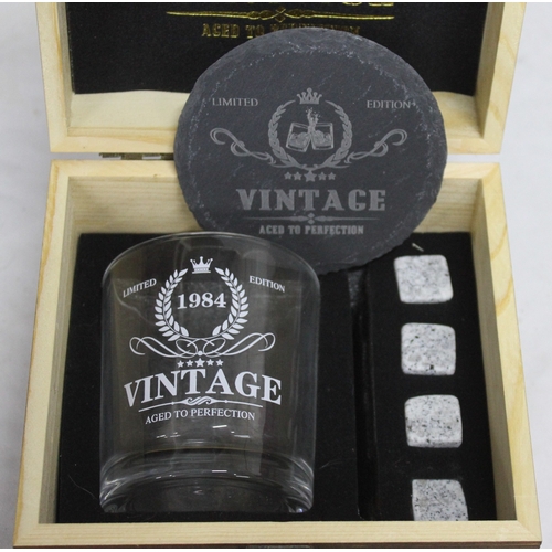 114 - 8 SETS OF WHISKY GLASS, COASTER AND 4 WHISKY STONES IN WOODEN BOX - (6 x 1984, 2 x 2003)