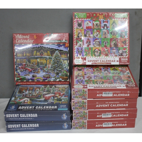 115 - 7 ADVENT CALENDAR JIGSAW PUZZLES AND BAG OF PHONE CASES