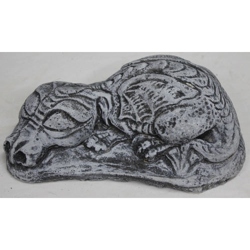 133 - 2 GARDEN ORNAMENTS - 1 SLEEPING DRAGON AND 1 HEDGEHOG WITH SHOVEL
