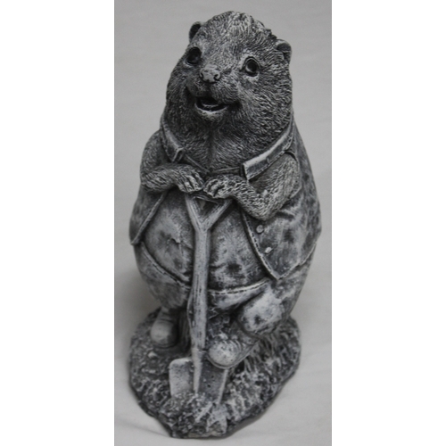 133 - 2 GARDEN ORNAMENTS - 1 SLEEPING DRAGON AND 1 HEDGEHOG WITH SHOVEL