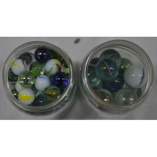 143 - 2 JARS OF GLASS MARBLES