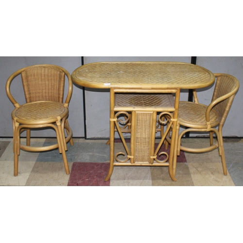 52 - BAMBOO AND CANE BISTRO DINING SET COMPRISING OF TABLE AND 2 CHAIRS