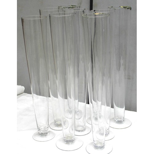 21 - VARIOUS LARGE GLASS VASES INCLUDING A SET OF 9 TALL STEM GLASSES CONICAL VASES