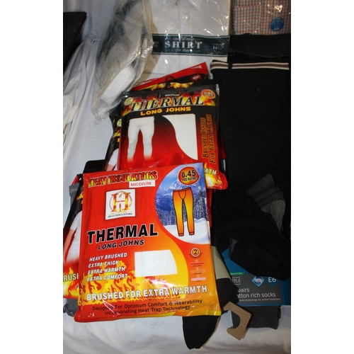 232 - BOX OF NEW CLOTHES INCLUDING SHIRTS, TROUSERS AND SOCKS