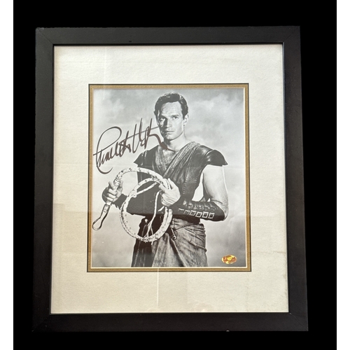 110 - Charlton Heston signed black and white photo from the movie Ben-Hur. Mounted and framed, measures 16... 