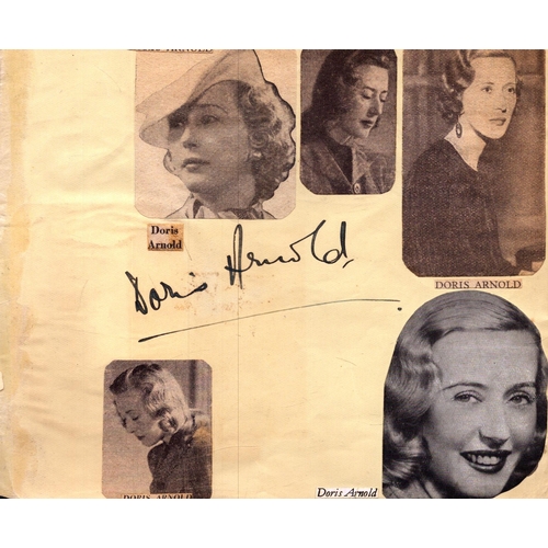 215 - Doris Arnold  signed paper with newspaper photo cutouts attached.