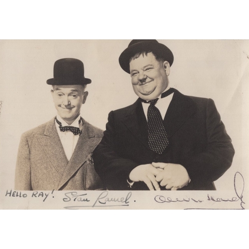 570 - Laurel and Hardy, legendary comic due, signed 6.5x4.25 inch B&W postcard, nice signatures.