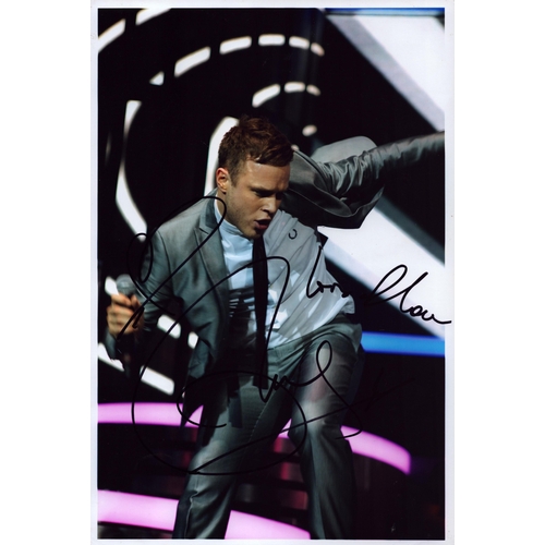 128 - Olly Murs signed 12x8inch colour photo.