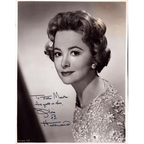 75 - Olivia de Havilland signed 10x8inch black and white photo.