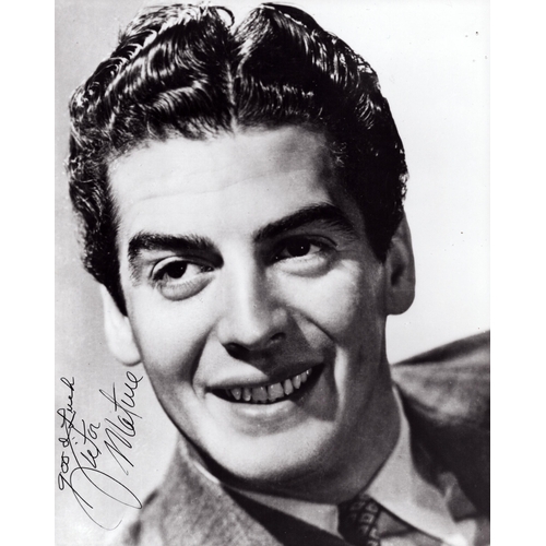 77 - Victor Mature signed 10x8inch black and white photo.