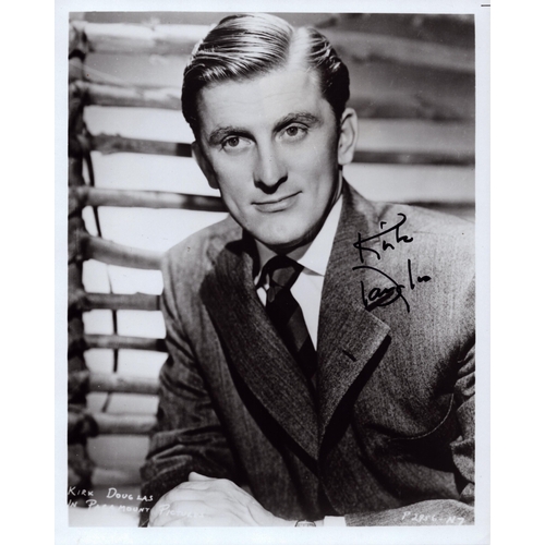 87 - Kirk Douglas signed 10x8inch black and white photo.